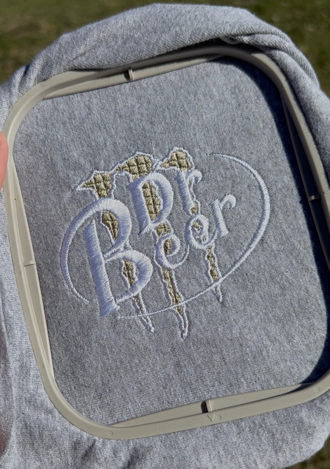 Close-up of an embroidery machine stitching a detailed patch