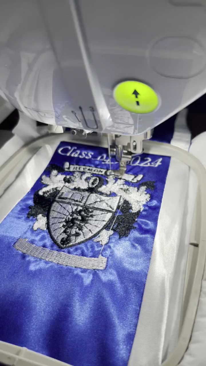 Video: stitching a graduation stole crest reading Class of 2024